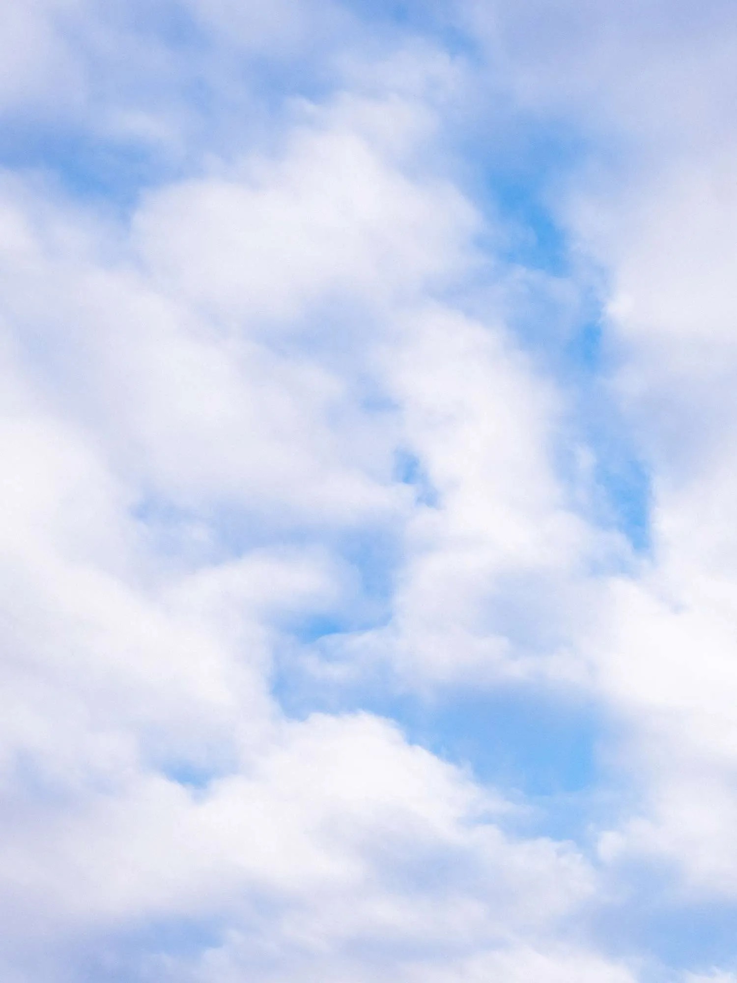 White clouds against a blue sky
